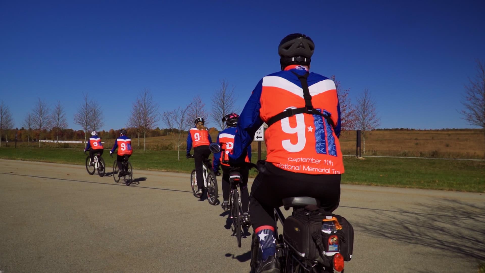 Cyclists on the trail through scenic landscape